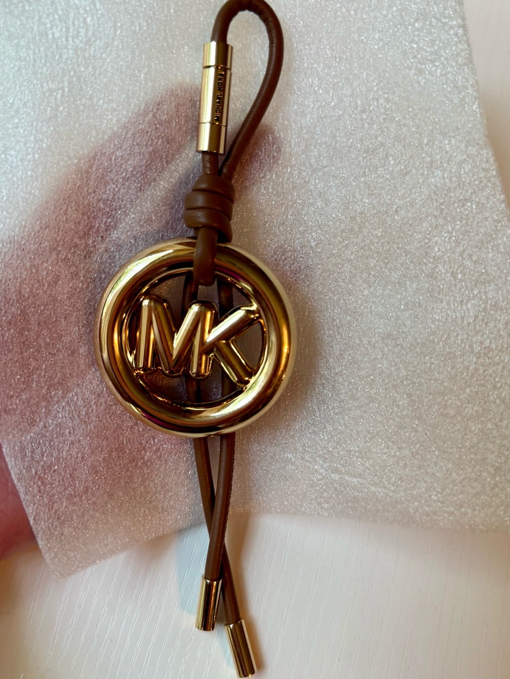 Michael Kors Gold and Brown MK Circle Tassel Charm